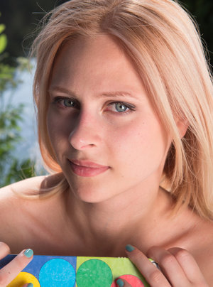 1 dark haired female tortures another during lezdom play in concrete cellar